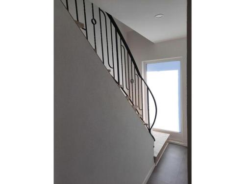 a staircase in a house with a window at Lovely apartment in Hambuch in Hambuch