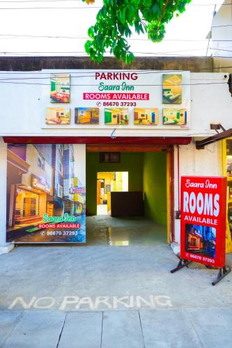 a building with no parking signs and a no parking garage at SAARA INN in Puducherry