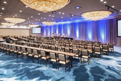 a conference room with rows of tables and chairs at The Westin Oaks Houston at the Galleria in Houston