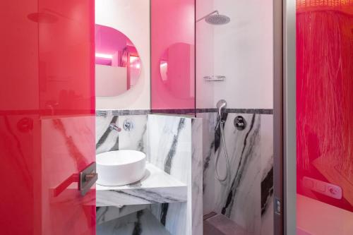a bathroom with a sink and a shower at Reverie in Limenaria