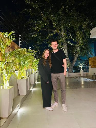 a man and a woman posing for a picture at The Cozy Chaos in Agra