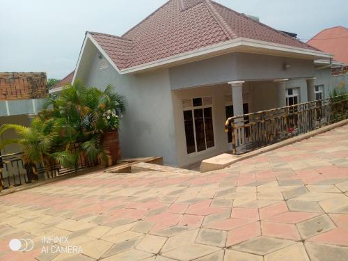 a house with a porch and a patio at Remera in Kigali