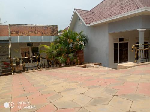 a house with a patio in front of it at Remera in Kigali