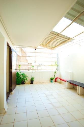 an empty room with a ping pong table in a building at SAARA INN in Puducherry