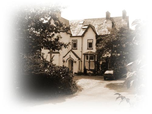 an old black and white photo of a house at Meadowbank in Ambleside