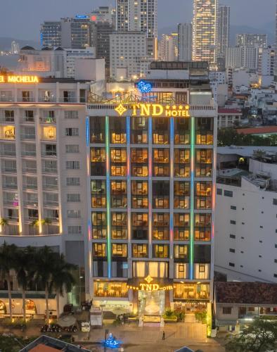 a building with a hotel sign on top of it at TND Hotel in Nha Trang