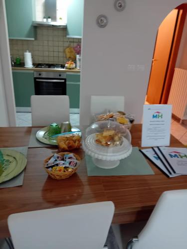 a table with a plate of food on top of it at Matteo's House in Penne