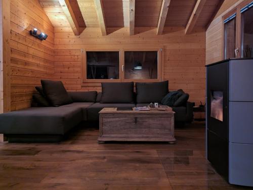 a living room with a couch and a coffee table at Chalet Adler in Saas-Fee