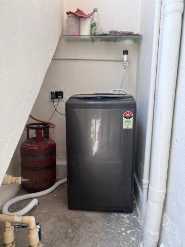 a water heater sitting in a corner of a room at 2BHK with parking & ample space in Bengaluru