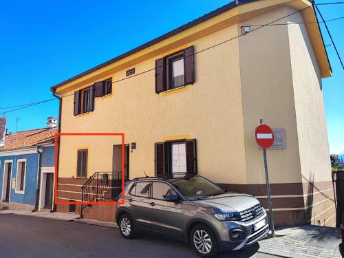 a silver car parked in front of a building at City apartment Rina in Crikvenica