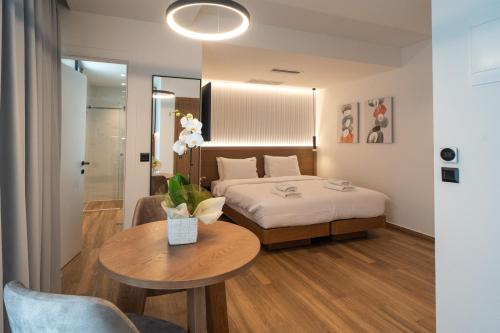 En eller flere senger på et rom på Volos Inn Hotel