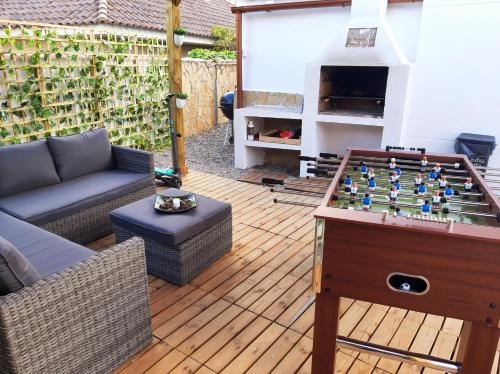 a living room with a chess board on a table at Villa Cambrils Mar in Cambrils