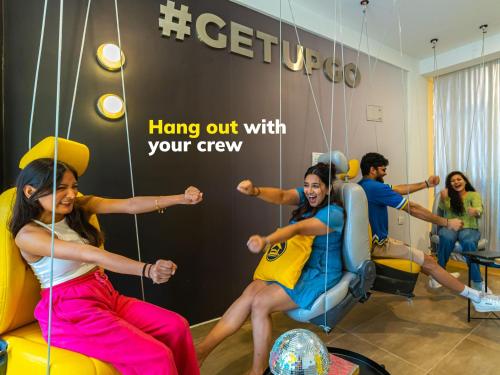 a group of people playing a game in a gym at The Hosteller Bangalore, Koramangala in Bangalore