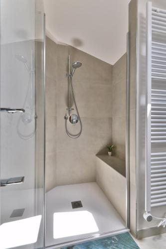 a bathroom with a shower and a sink at La Limonaia - Theater Home in Gargnano