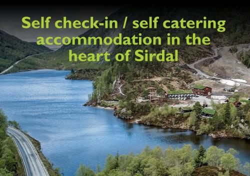 a river with the words self check in i self catering accommodation in the heart at Sirdal fjellpark in Tjørhom