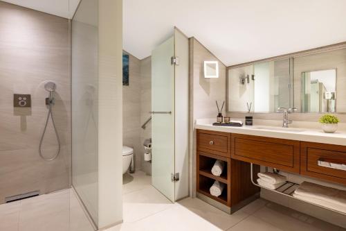 a bathroom with a sink and a shower at Tzl Suites Hotel Nişantaşı in Istanbul
