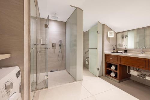 a bathroom with a shower and a sink at Tzl Suites Hotel Nişantaşı in Istanbul