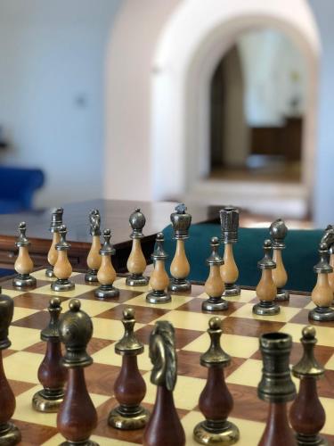 a close up of a chess board with chess pieces at VillaGrancassa Hotel Relais in San Donato Val di Comino