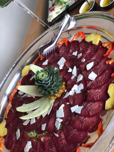 a plate of food with a fork and vegetables at VillaGrancassa Hotel Relais in San Donato Val di Comino