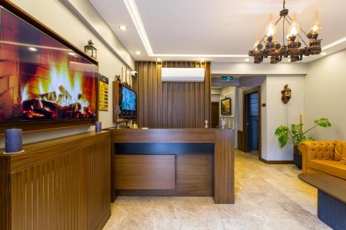 a bar in a hotel lobby with a reception desk at Dream Park Hotel in Istanbul