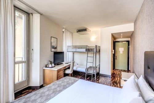 Un ou plusieurs lits dans un hébergement de l'établissement Albergo Firenze