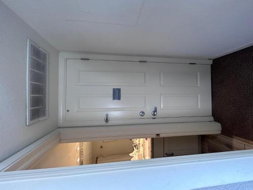 a room with a white garage door and a window at Sleeps 2 - Free Parking - DTC Boston Commons in Greenwood Village