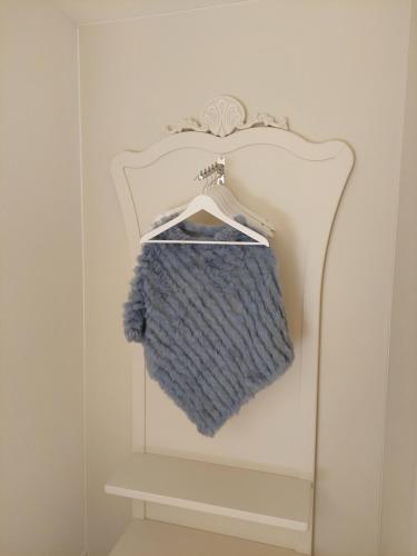 a blue towel is hanging on a towel rack at Dolceresio Lugano Lake B&B in Brusino Arsizio