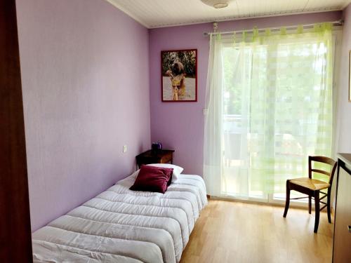 Postel nebo postele na pokoji v ubytování La Capeline