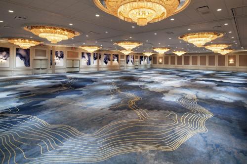 a ballroom with a large floor with a painting on it at The Westin Galleria Houston in Houston