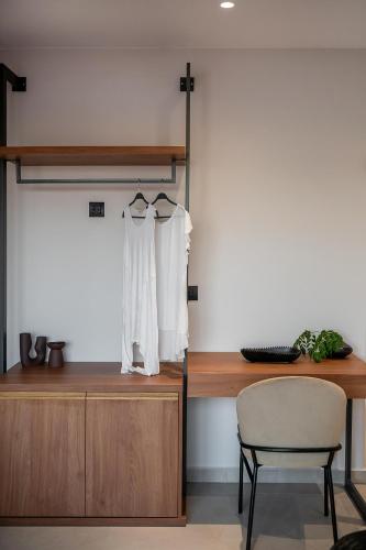 a room with a desk and a chair and a table at Theta Boutique Hotel in Chania