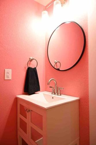 a bathroom with a sink and a mirror at 1 Block to Lake Eufaula! in Eufaula