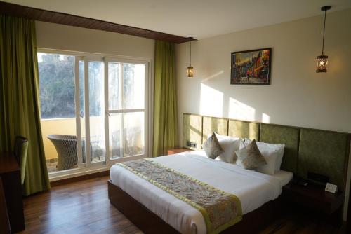 Posteľ alebo postele v izbe v ubytovaní SHUKRANA RESORT & SPA