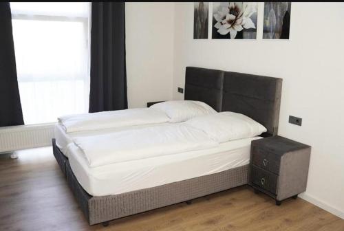 a large bed in a room with at Sweet Rooms in Bubesheim