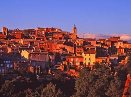 a group of buildings on top of a hill at Appartement Roussillon in Roussillon