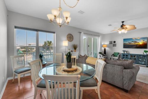 a living room with a table and chairs and a couch at Bonita Bay in Pensacola Beach
