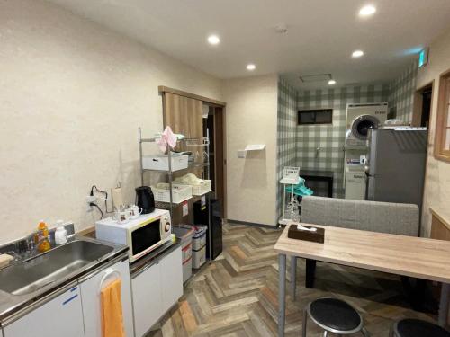 Kuchyň nebo kuchyňský kout v ubytování GuestHouse Guu