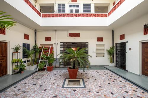 a room with a courtyard with potted plants at Heart of the City Homestay by Rashmi in Jaipur