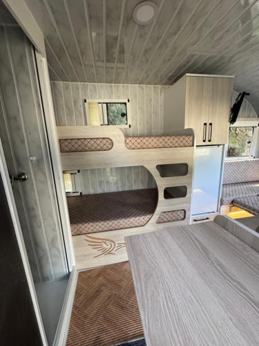 an interior view of a small kitchen in a recreational vehicle at KAYACIK TESİSİ in Dalaman
