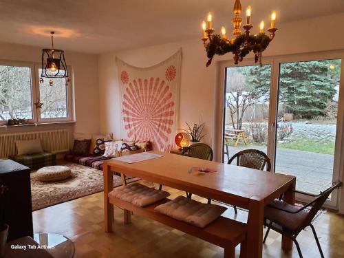 a living room with a wooden table and a couch at CasaLucía - hometel in Puchberg am Schneeberg