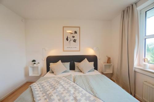 Postel nebo postele na pokoji v ubytování Südstrand Apartment