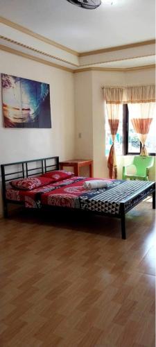 a bedroom with a large bed in a room at Cody Homestay in Burgos