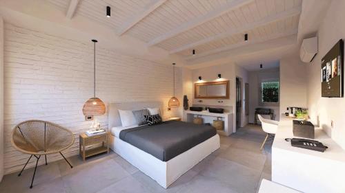 a bedroom with a bed and a living room at Nomad Boutique Hotel Side - Adults Only in Side
