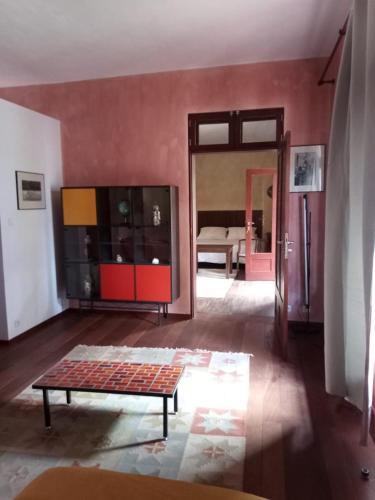a living room with a couch and a table in it at Casa Azul in Mindelo