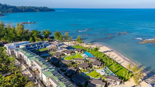 an aerial view of the resort and the beach at The Little Shore Khao Lak by Katathani in Khao Lak