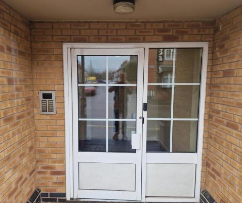 a white door on a brick house at Childes Court in Nuneaton