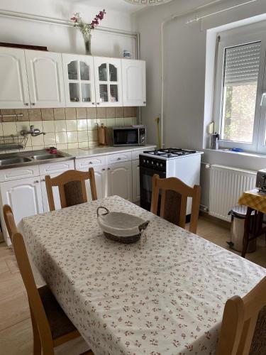a kitchen with a table with a bowl on it at Károly Vendégház in Hévíz