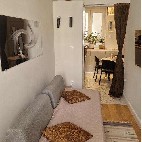 a living room with a couch and a table at Old Town Apartment in Omiš