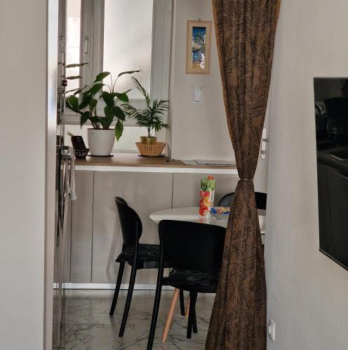 a dining room with a table and chairs at Old Town Apartment in Omiš
