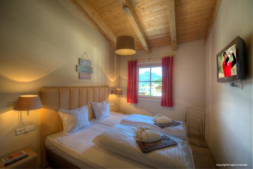 Ένα ή περισσότερα κρεβάτια σε δωμάτιο στο Kaprun Mountain Resort by Kaprun Rentals