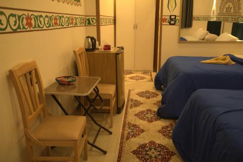 Postel nebo postele na pokoji v ubytování Al Baeirat Hotel